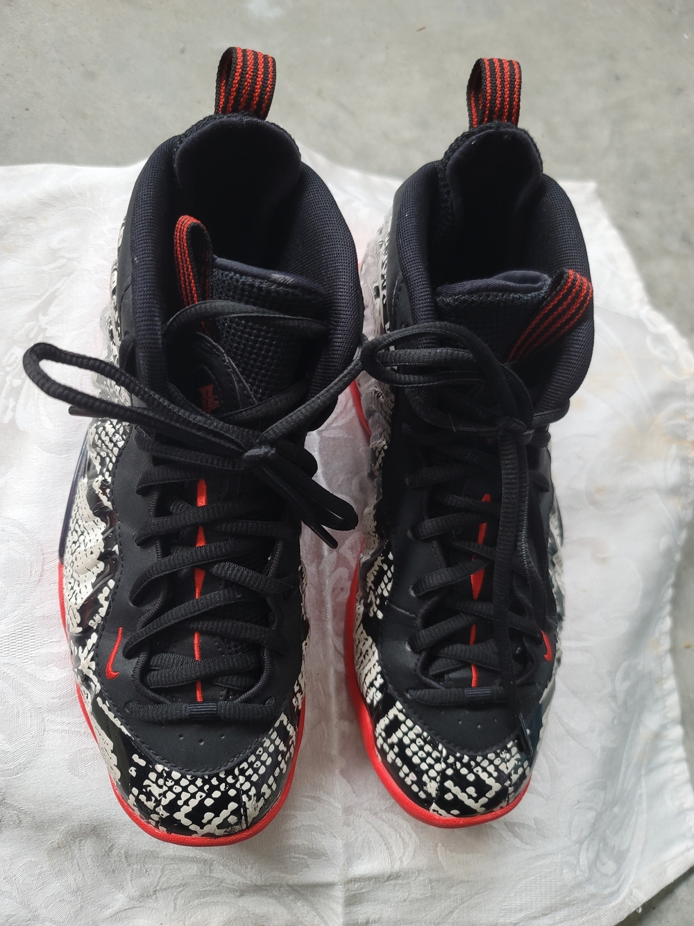 Nike Black Sneakers with Red Stitch Detailing